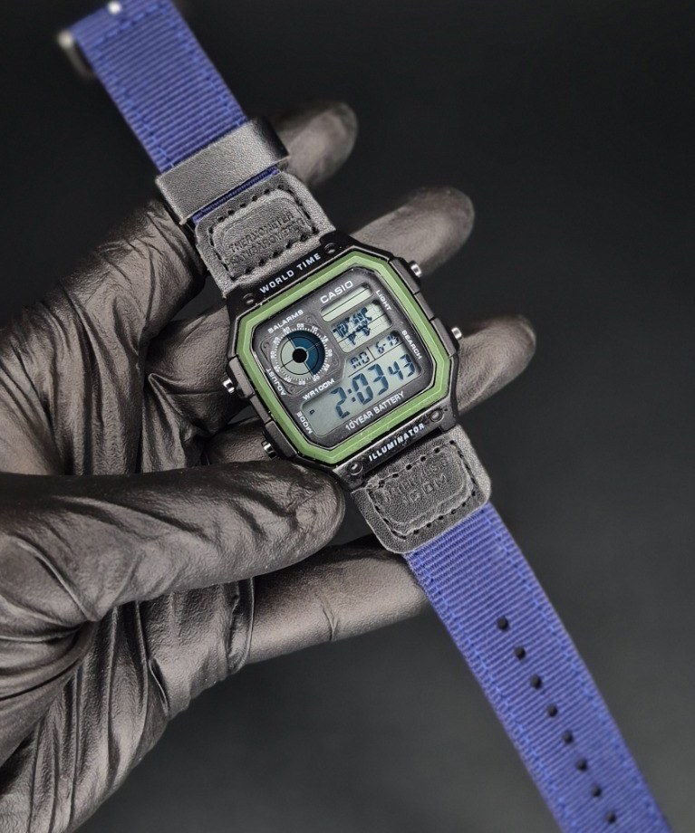 ساعت کاسیو مدل جهان نما با بند برزنتی، رنگ آبی و سبز
