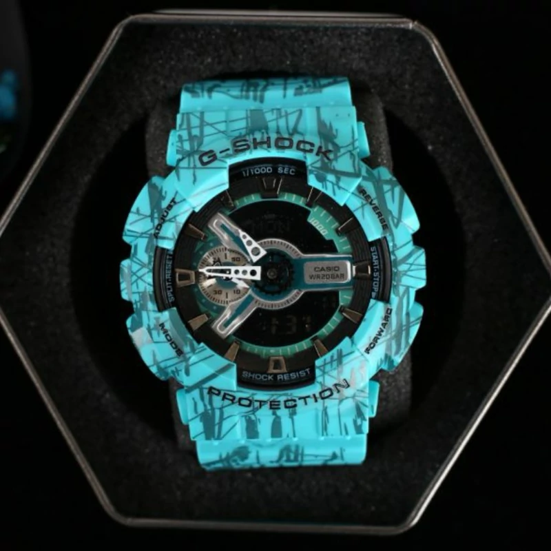 ساعت  مچی جی شاک GA110 آبی خط خط  (جیشاک GShock) ، صد در صد ضدآب ، تنظیم اتوماتیک با پایتخت کشورها ، اتولایت دار